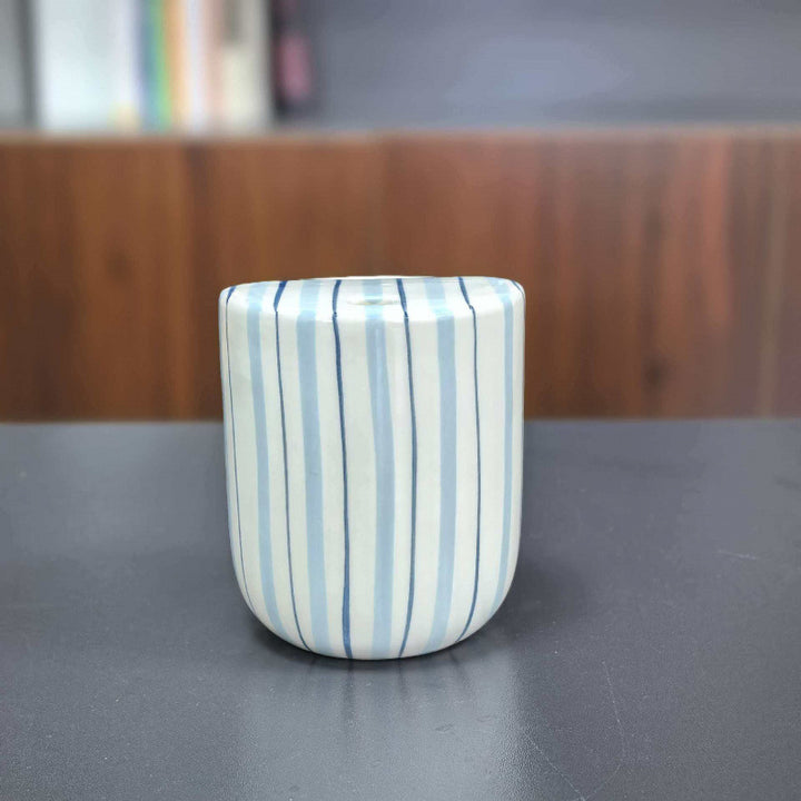 Ceramic coffee mug with stripes and heart design