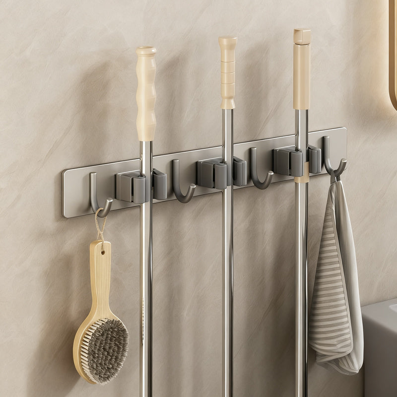 Wall bracket for brooms and mops made of stainless steel