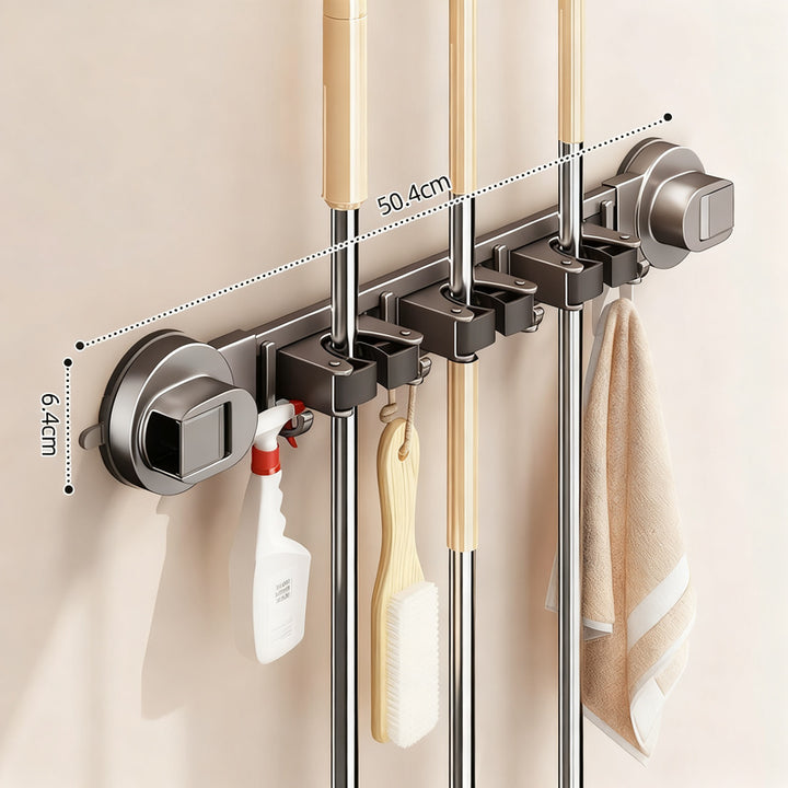 Suction cup holder for brooms and cleaning tools