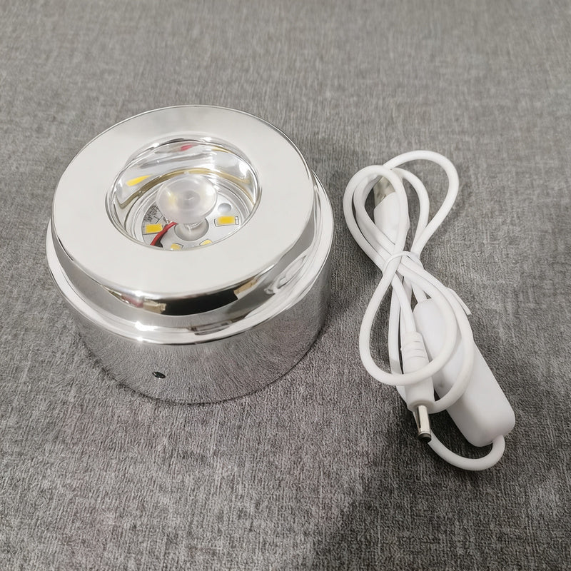 Glowing crystal ball with rotating base