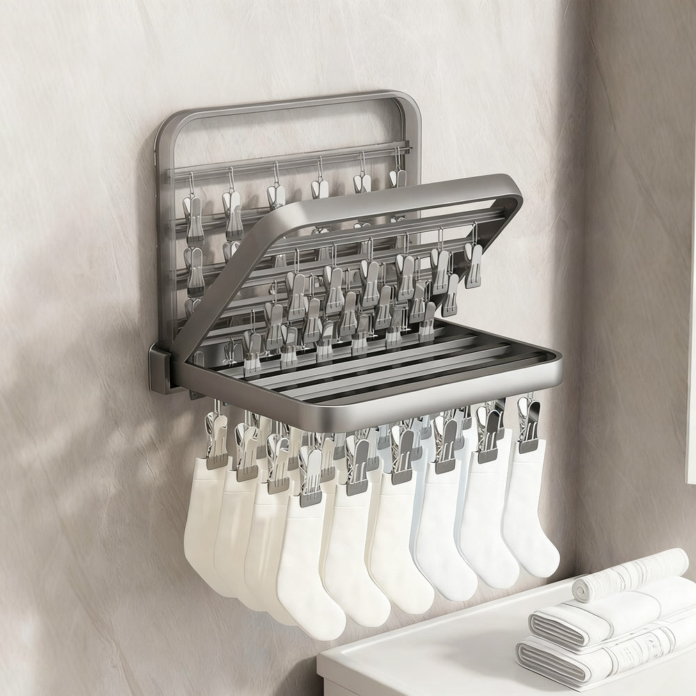 Wall-mounted clothes dryer with clamps