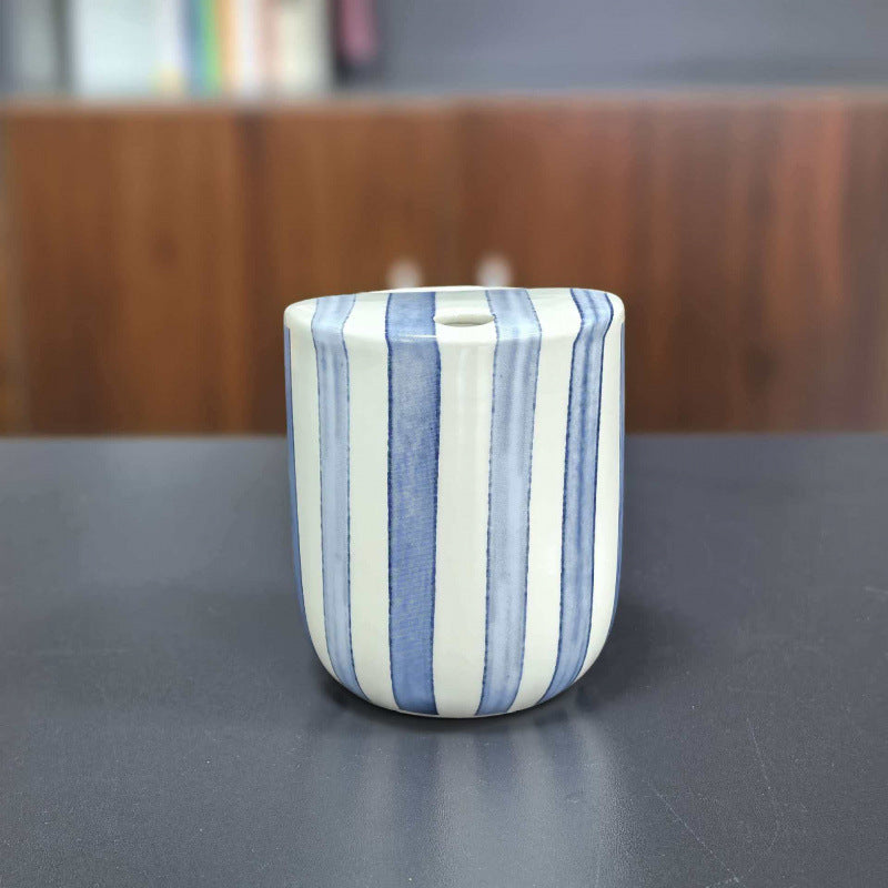 Ceramic coffee mug with stripes and heart design