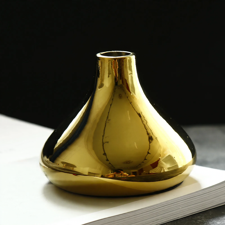 Ceramic flower vase with gold finish, geometric