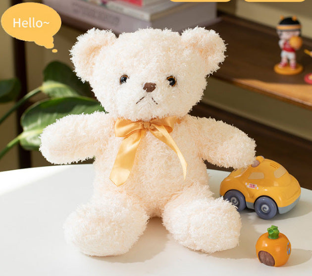 Plush teddy bear with bow, 25–30 cm