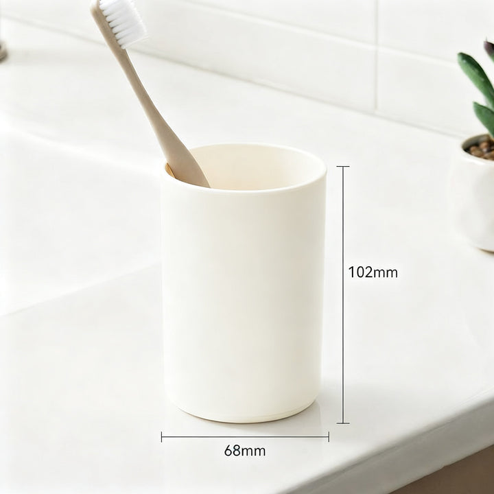 Magnetic toothbrush and rinse cup holder