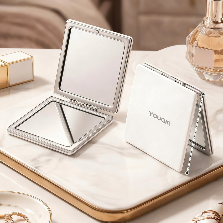 Folding cosmetic mirror, double-sided