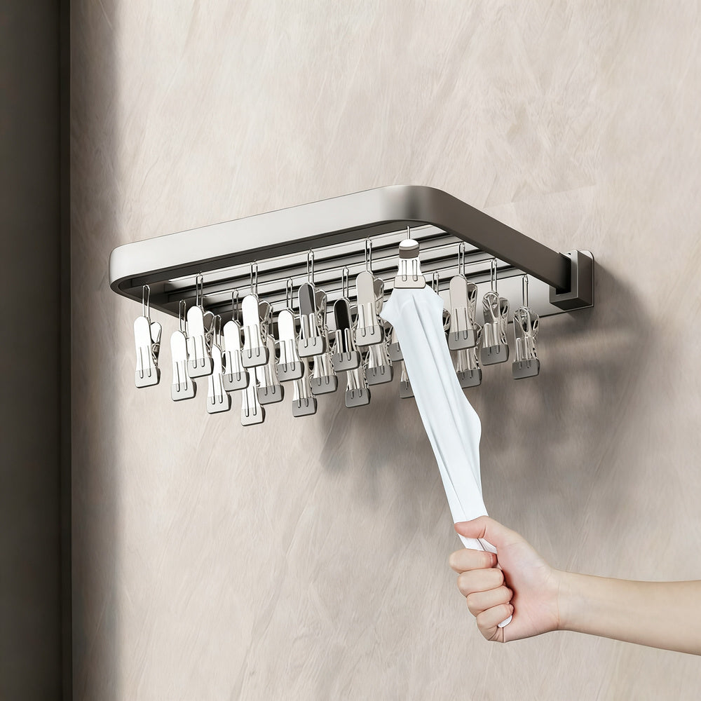 Wall-mounted clothes dryer with clamps