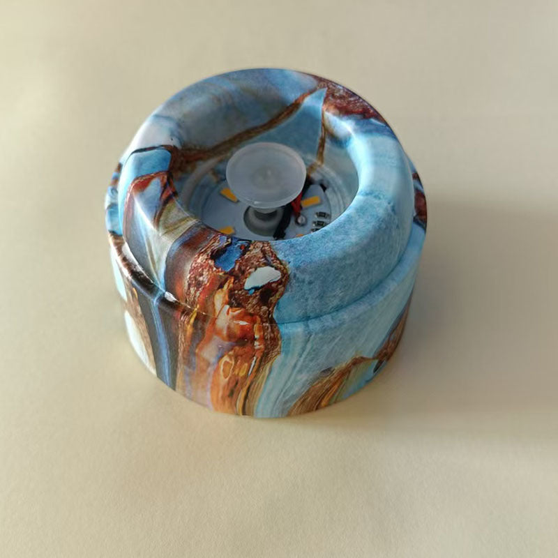 Glowing crystal ball with rotating base