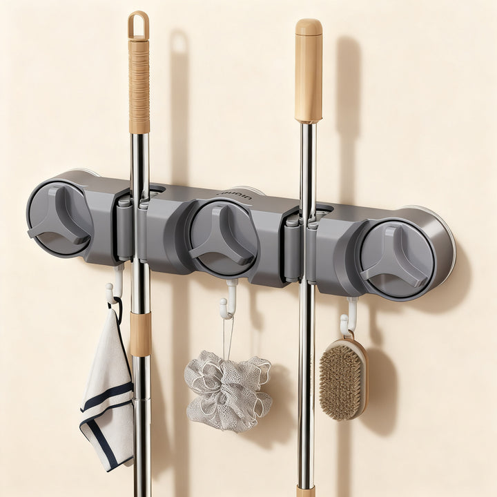 Suction cup holder for broom and mop