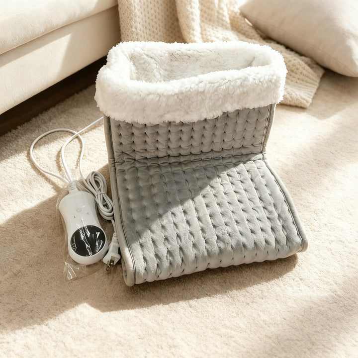 Electric foot warmer with button switch