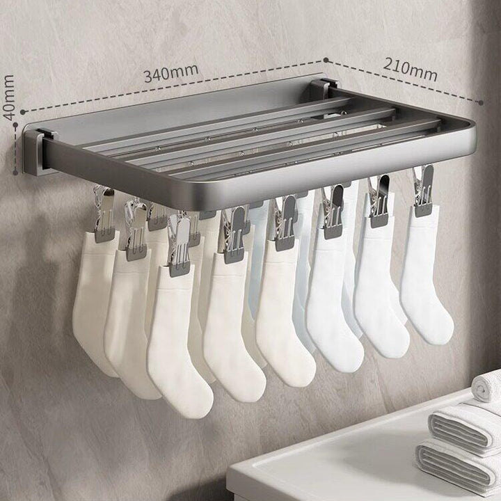 Wall-mounted clothes dryer with clamps