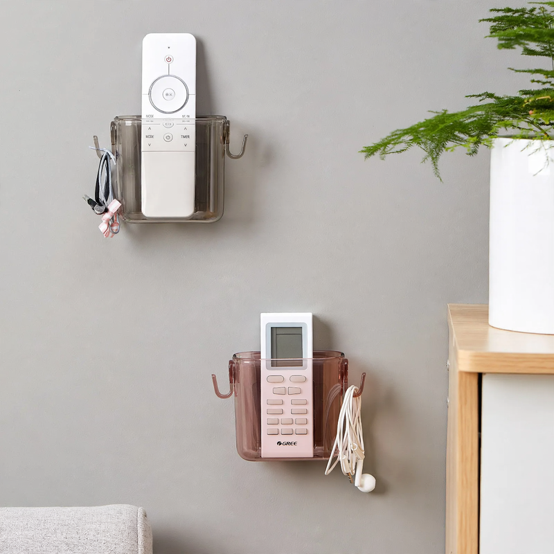 Wall-mounted storage box for remote controls and phones