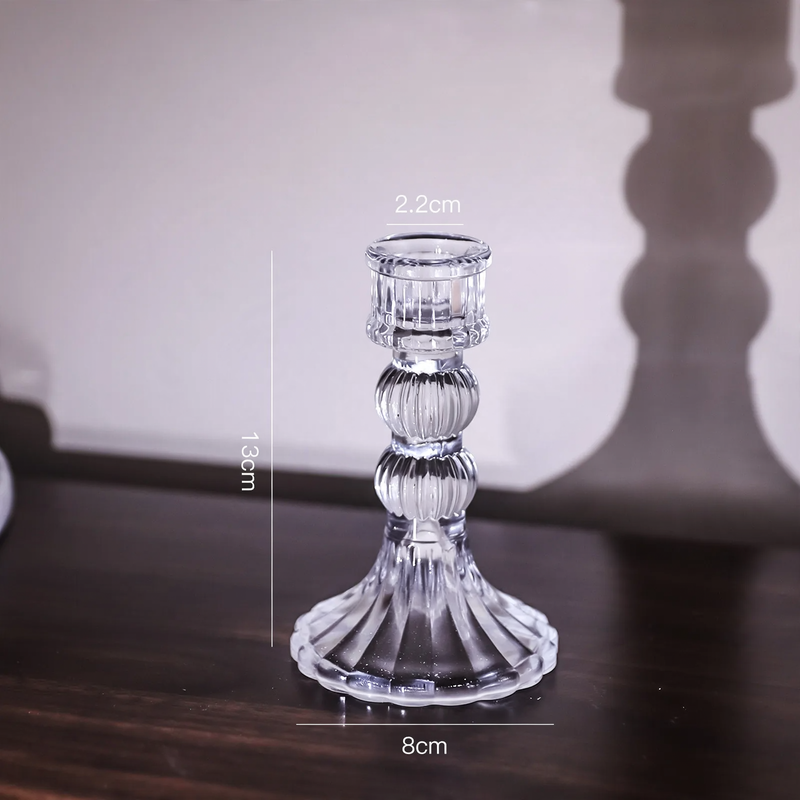 Glass candle holders in various shapes