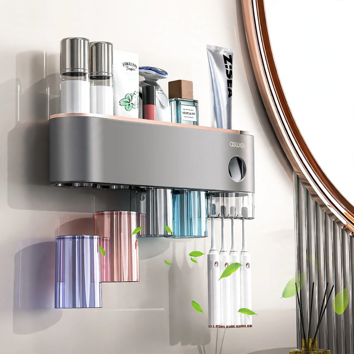 Toothbrush wall holder with toothpaste squeezer