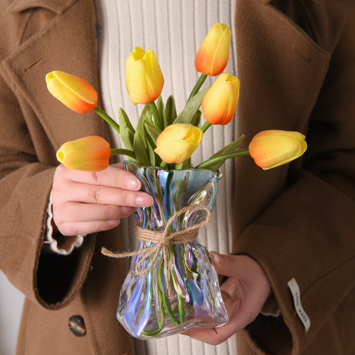 Glass vase with irregular folding pattern