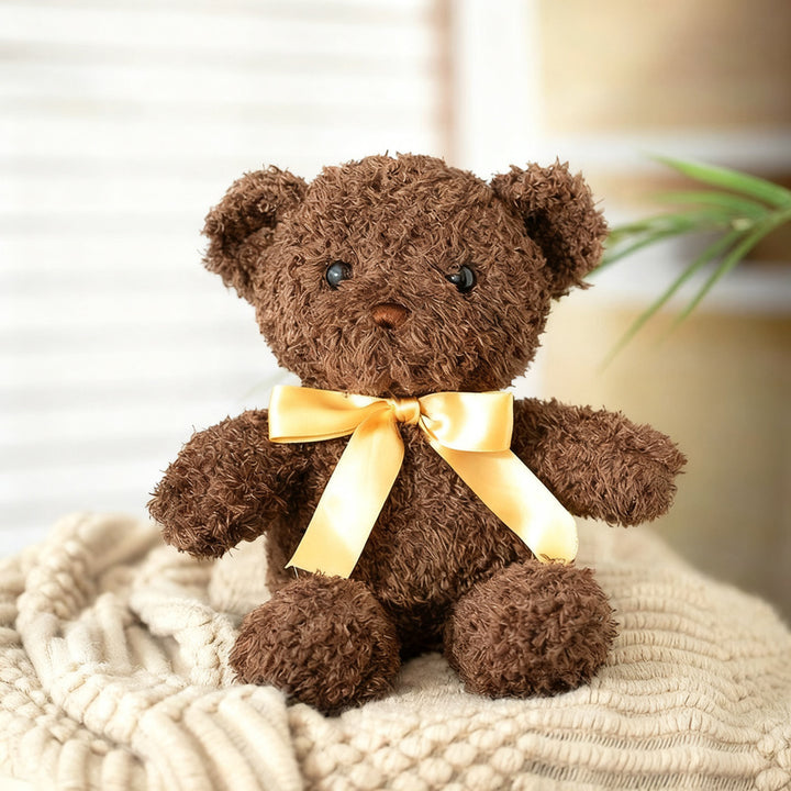 Plush teddy bear with bow, 25–30 cm