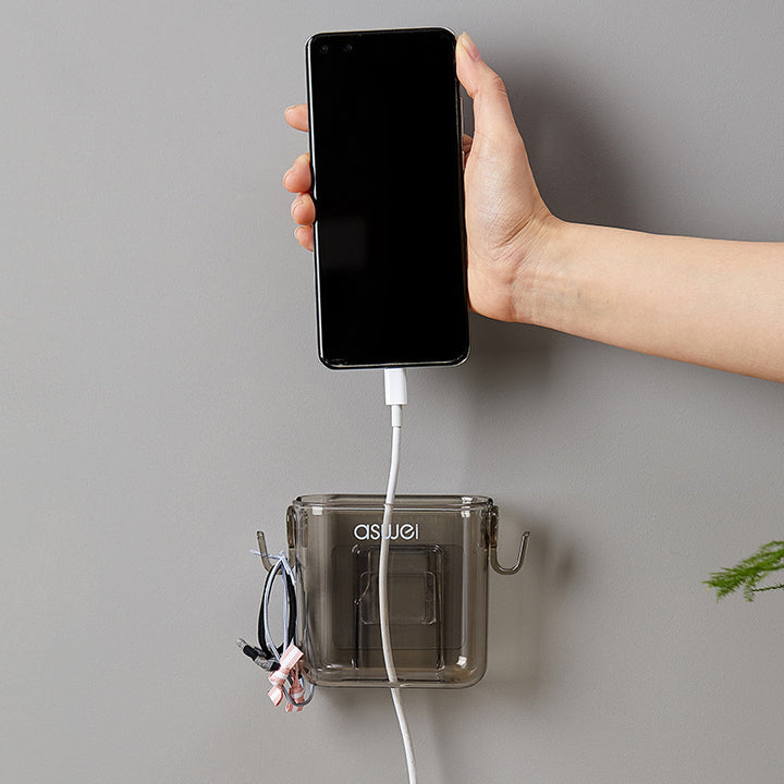 Wall-mounted storage box for remote controls and phones