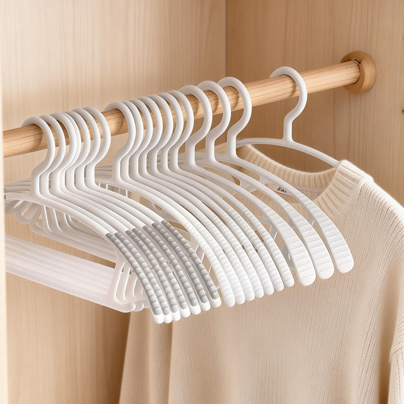 Plastic clothes hanger with anti-slip protection