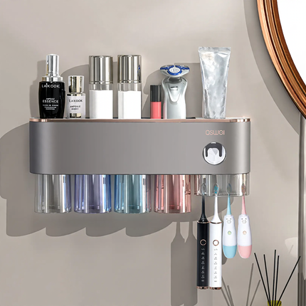 Toothbrush wall holder with toothpaste squeezer