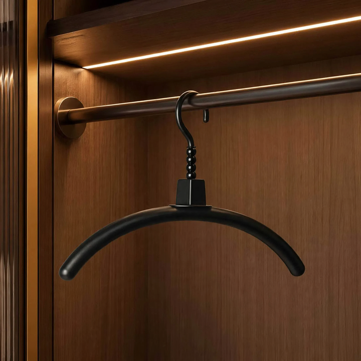 Plastic clothes hanger with non-slip surface