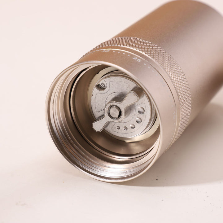 Hand coffee grinder with CNC grinding mechanism and brush