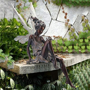Kalsten | Statue of sitting fairy in the garden